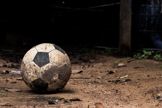 Soccer on old shabby ball.
