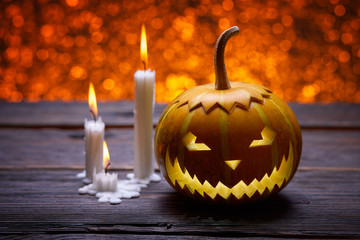 Pumpkins for Halloween and burning candles