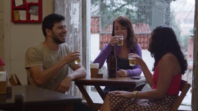 Friends drinking beer and laughing