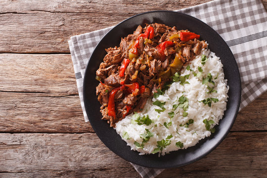 ropa vieja: beef stew in tomato sauce with vegetables and rice. horizontal top view
