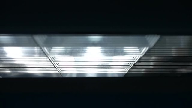 Fluorescent lights turning on and off