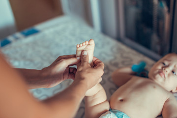 Massage a small baby.