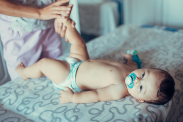 Masseur doing massage a small baby.