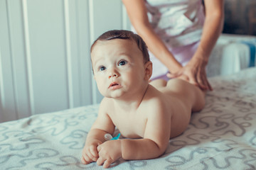 Four months old baby enjoying massage