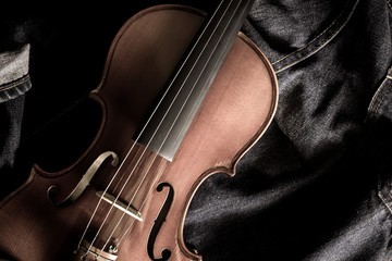 part of classical violin on denim jeans for music background