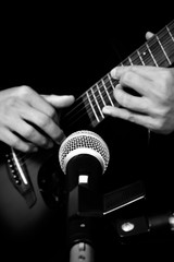 Fototapeta premium musician hands playing & recording acoustic guitar