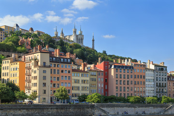 Fototapeta premium Colorful Vieux Lyon and Fourviere Basilica seen from the Saone riverbank.