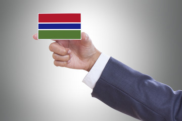 Businessman holding a business card with Gambia Flag 