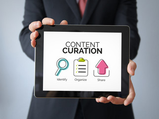 businessman with content curation concept on a tablet
