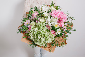 Florist at work. Make hydrangea rich bouquet. colorful 