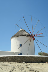 Mykonos, Greece. Traditional windmill before blue sky. The windmills are the island’s landmark. © bestravelvideo