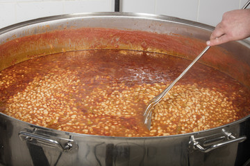 chef cooking beans at commercial kitchen-bean