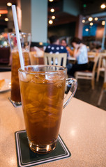 Glass of ice lemon tea in luxury restaurant
