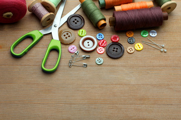 Sewing kit on wooden  background