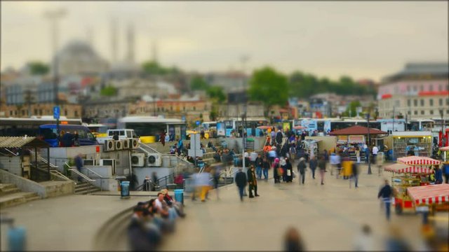 Titl shift. The movement of large groups of people on the background of the mosque. The end of the working day. People hurry home. Istanbul. Turkey. Time lapse. 4K