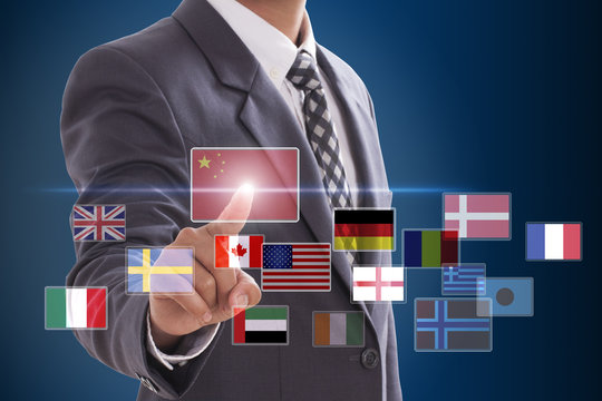 Businessman hand pushing on a touch screen interface, choosing China flag