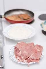 Frying pork meat in the frying pan