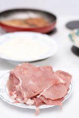 Frying pork meat in the frying pan