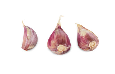 Three garlic cloves isolated on white background