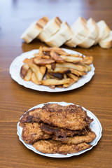 Breaded steaks served with fried potatoes