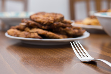 Breaded steaks served with fried potatoes