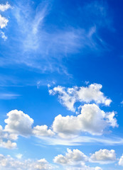 Blue sky with a cumulus and cirrus clouds
