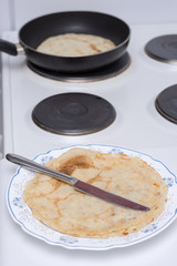 Frying pancakes on the stove