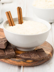bowls of rice pudding, on wood