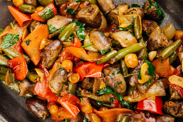 Fried chicken hearts with vegetables