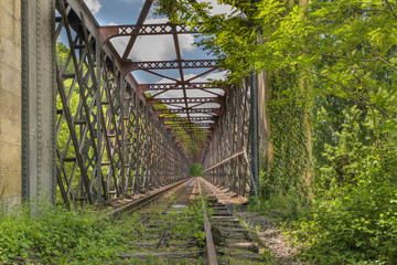 old abandoned railway bridge sunny day