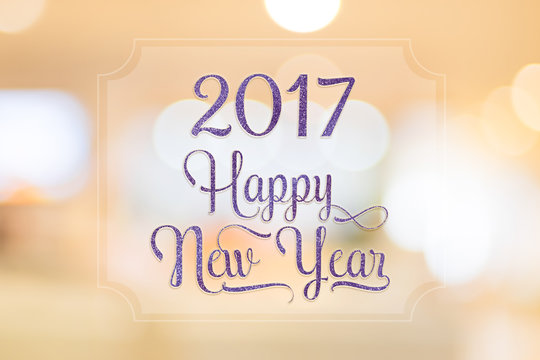 Happy New year 2017 glitter texture word on white frame at abstr