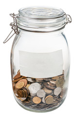 closed glass jar with empty label and saved coins