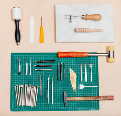 above view of various tools for leatherwork