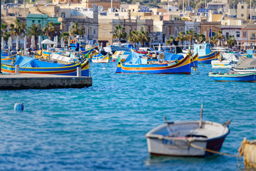 Fototapeta na wymiar Port and Luzzu in Marsaxlokk, Malta