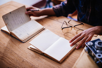 home office desk background, Desk musicians, hand holding pencil and writing note on wood...