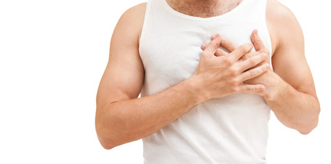 Young man with heart pain gesture, isolated