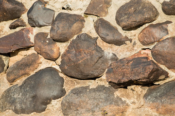 wall made of natural round stone background