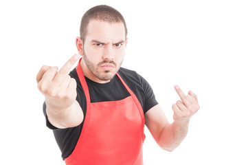 Aggressive supermarket employee doing double obscene sign