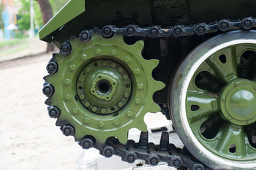 Fototapeta na wymiar Tracks of the tank on a pedestal close up