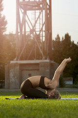 Fototapeta premium Flexible woman in sportswear doing yoga