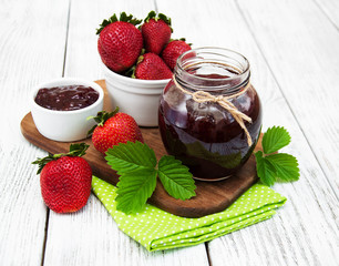 Strawberry jam and fresh strawberries