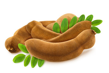 Isolated heap of fresh whole tamarinds with green leaves on white background. Design element for product label, catalog print, web use.