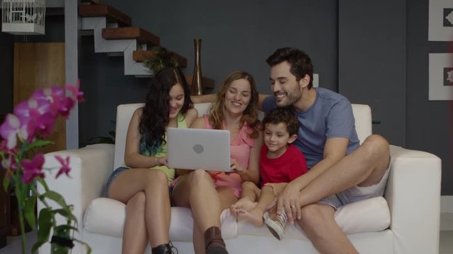 Young family using laptop