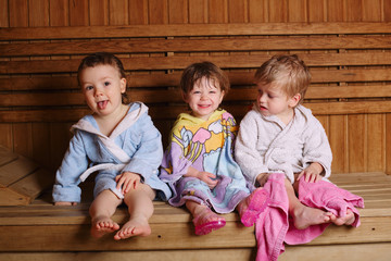 three funny children in sauna