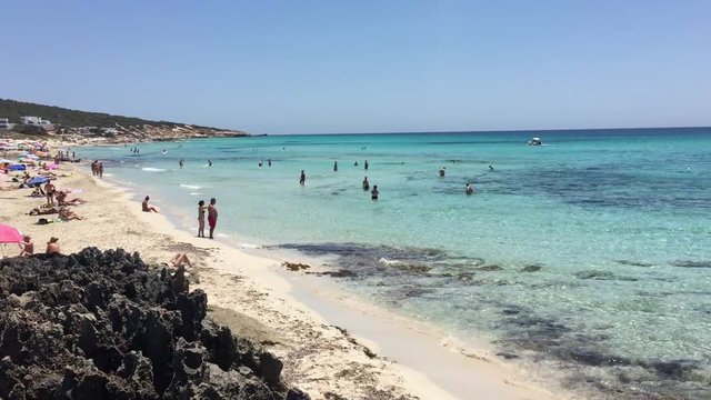 Awesome Cristal Blue Water Beach in Formentera Spain in a sunny day with very small waves.