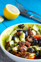 Fresh Healthy Salad with Avocado and Sun-Dried Tomatoes, Vertical View