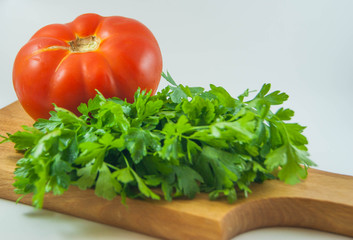 Obraz na płótnie Canvas Organic fresh red tomatoes and parsley isolated