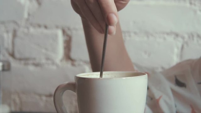 happy young beautiful woman drinking coffe in the cafe