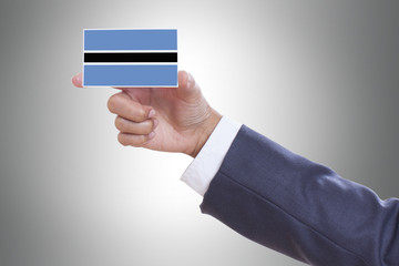Businessman holding a business card with Botswana Flag 