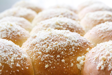 fresh hot sweet baked buns, close-up photo.